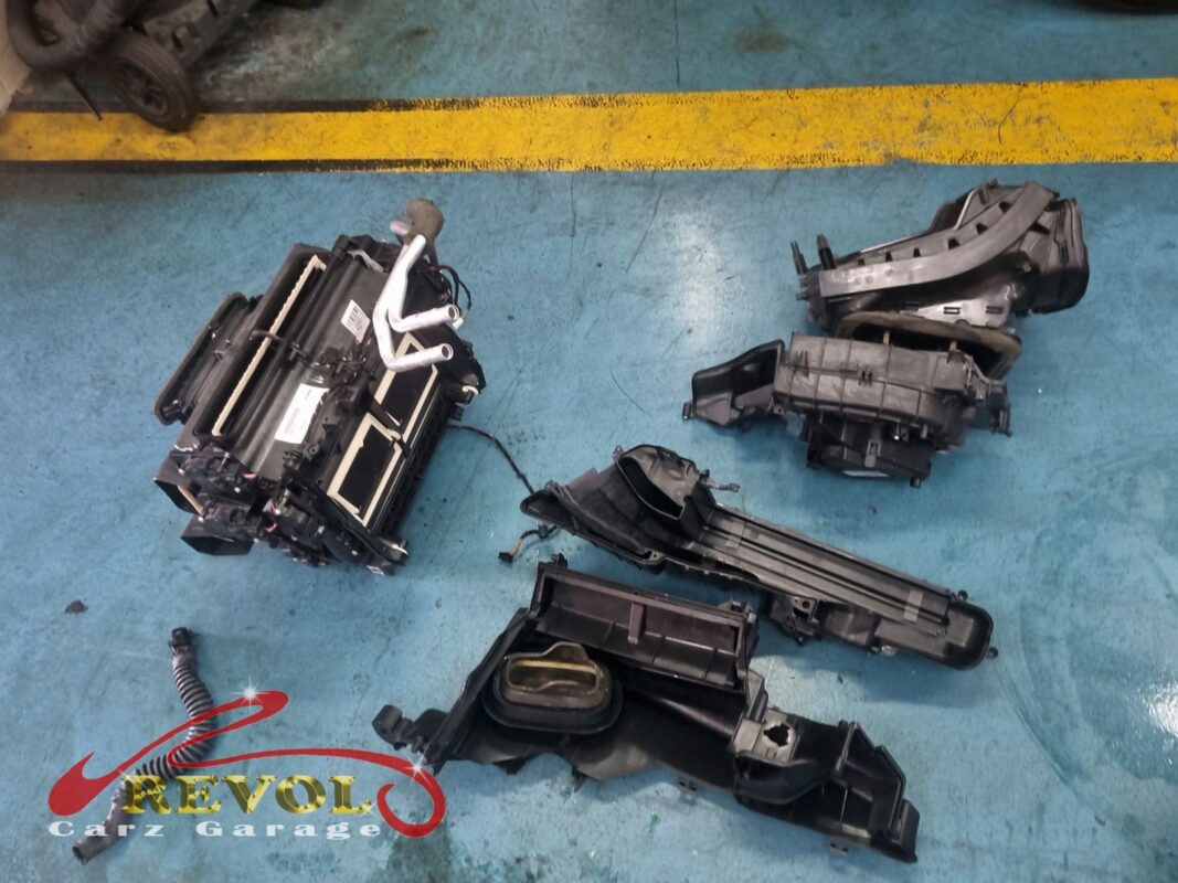 The HVAC box out of the car and stripped down, the air distribution housings separated to get at the core.