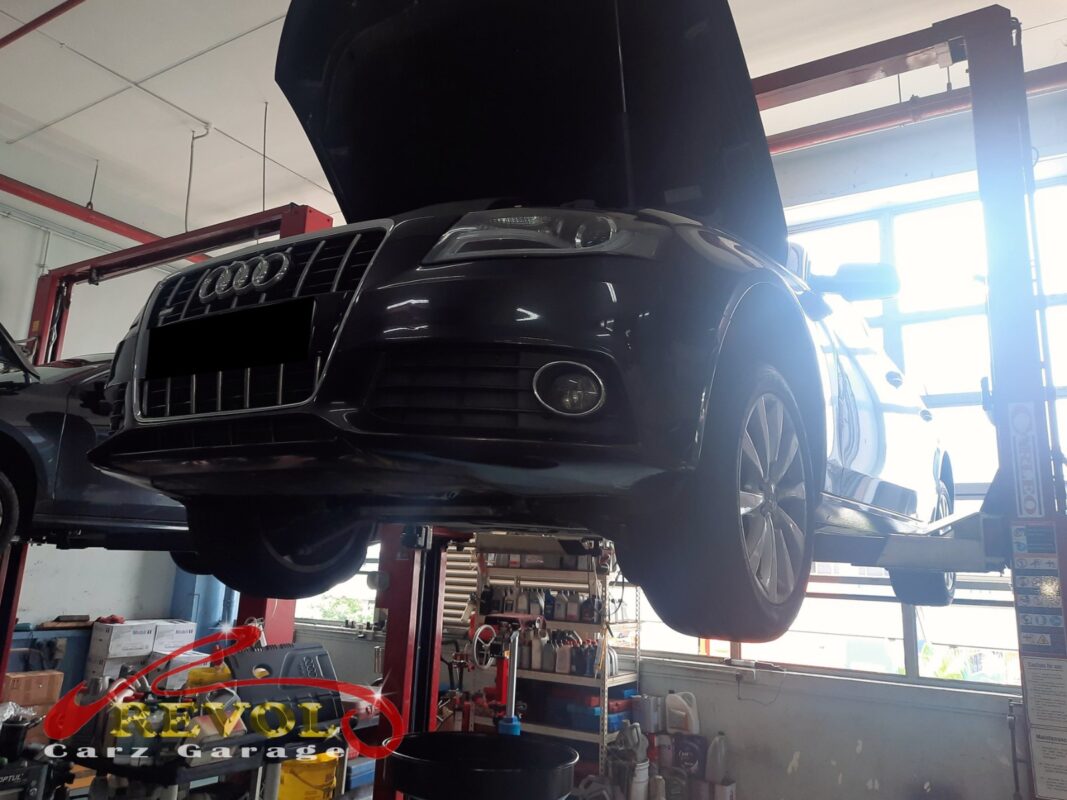 The Audi A4 up on the two-post lift, in for the AC condenser job.