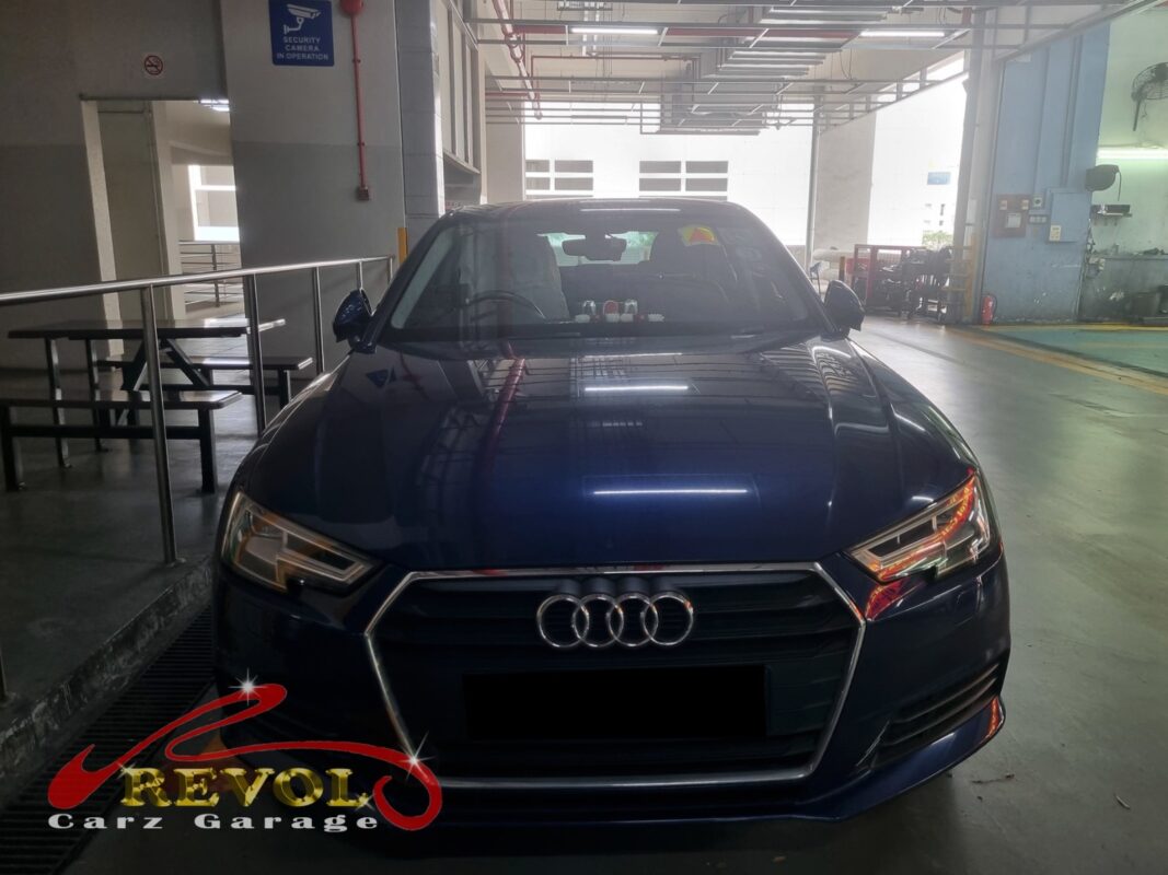 Audi A4 on the workshop lift for fan belt set replacement.