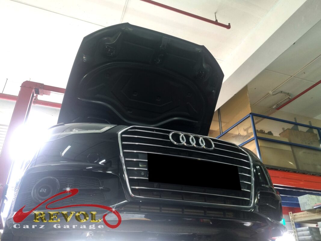 The Audi A6 up on the two-post lift, in to find the source of the oil leak.