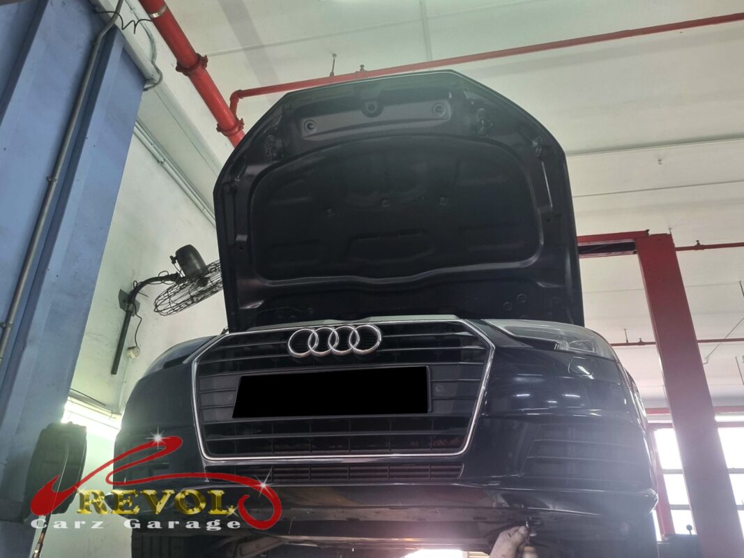 The Audi A4 up on the two-post lift, in to track down the oil leak.