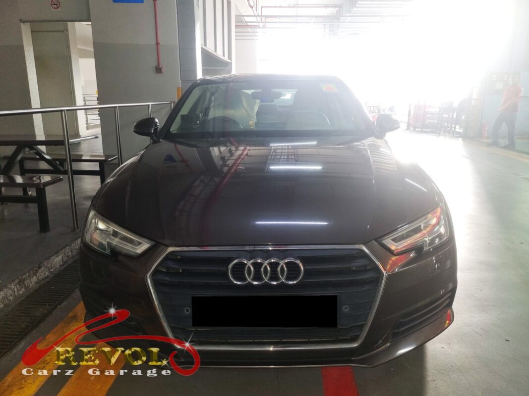 Audi A4 in the workshop for coolant leak diagnosis around the water pump.
