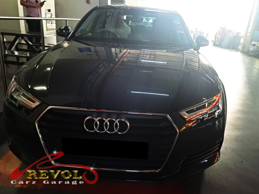 Audi A4 on the workshop lift for ATF oil pan replacement.