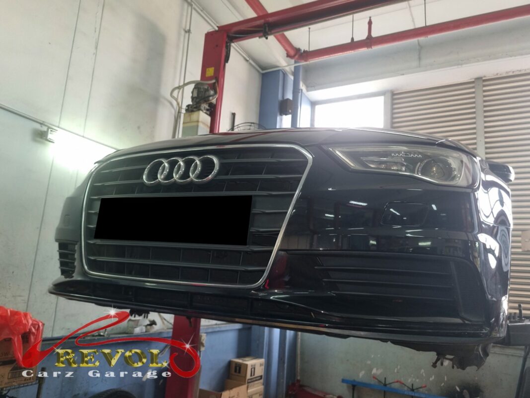 The Audi A3 up on the two-post lift, in to track down the hum on the motorway.
