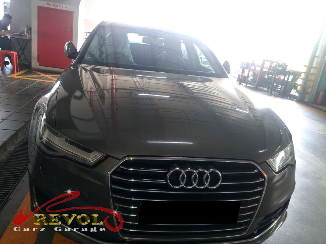 Audi A6 with the front bumper removed for radiator fan replacement.