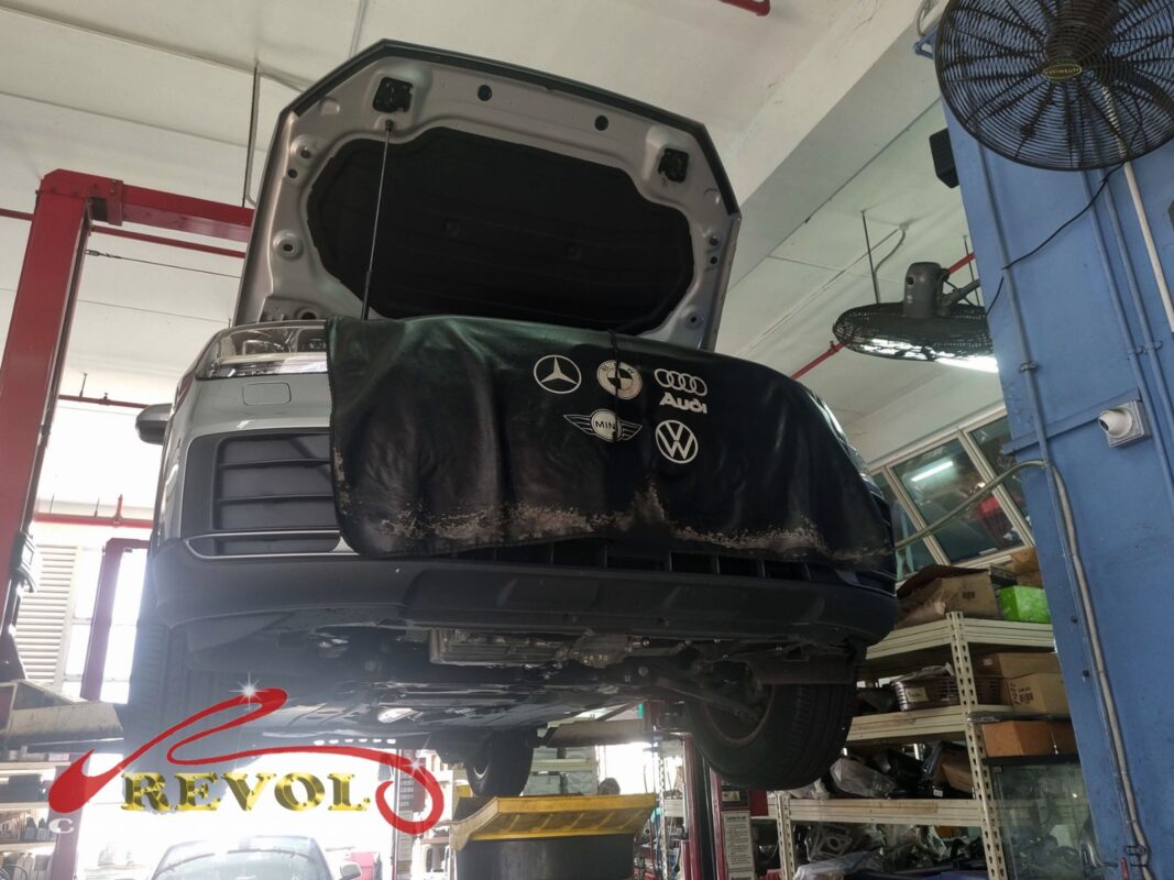 The Audi Q2 up on the two-post lift, fender cover on, in for the brake job.