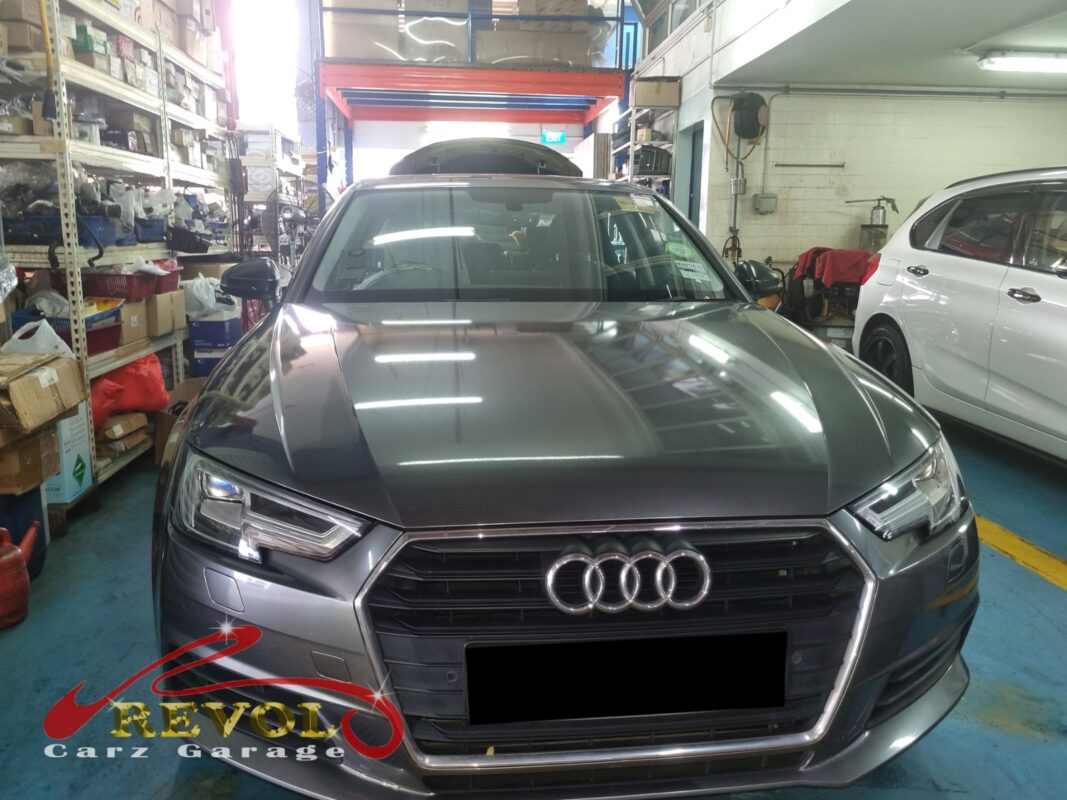 Audi A4 on the workshop lift ready for rear shock absorber set replacement.