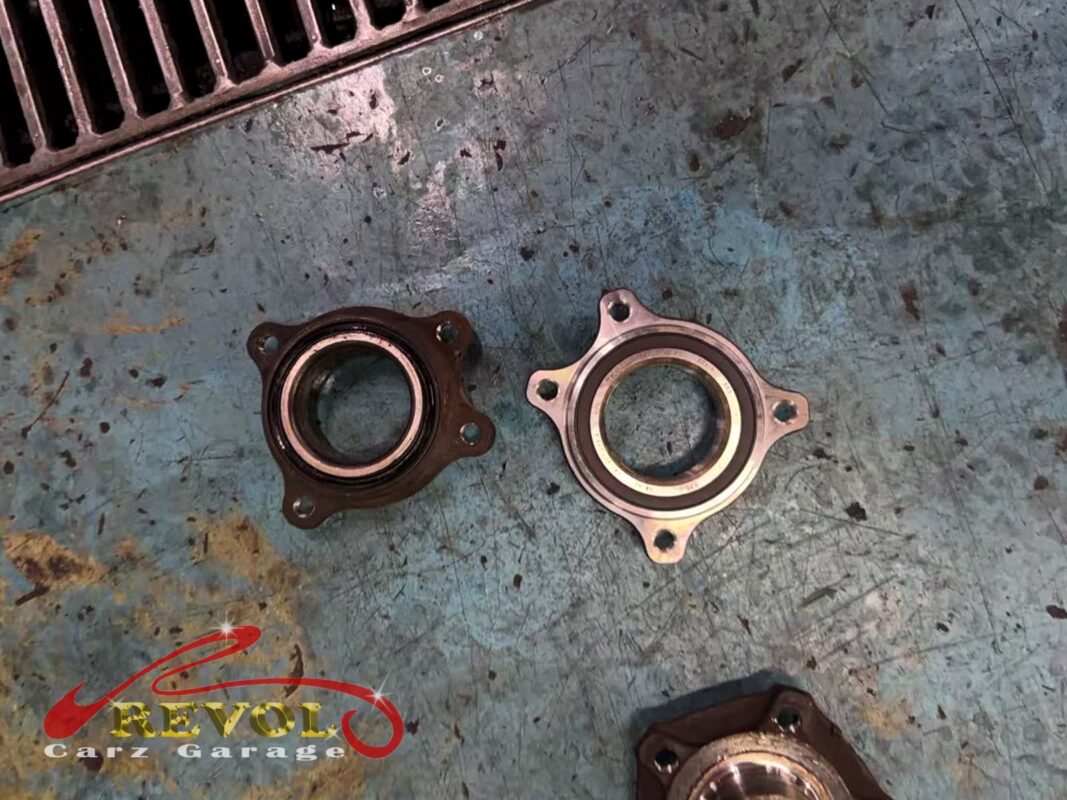 The new unit fitted to torque with the ABS sensor reconnected and the brakes rebuilt onto it.