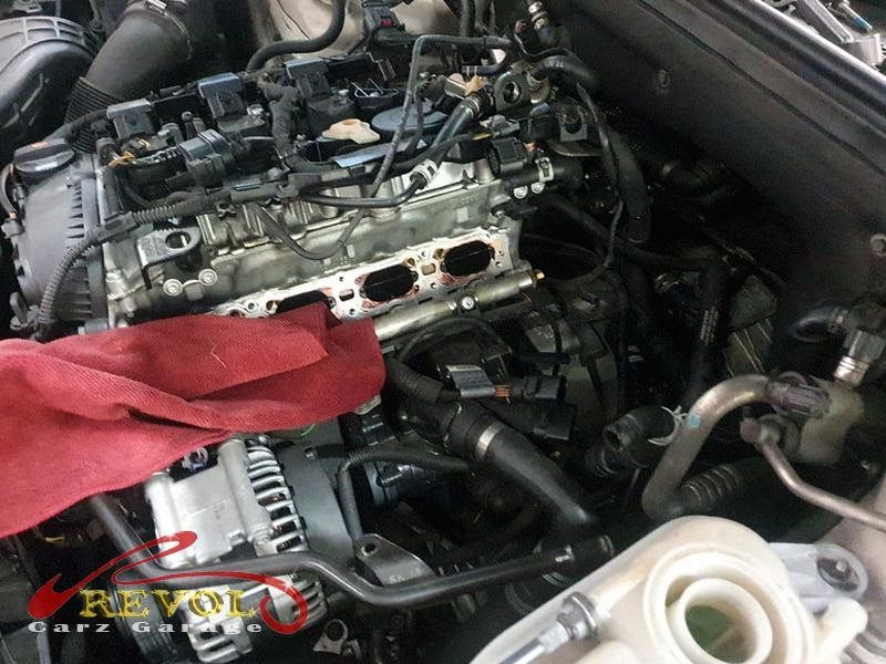 The perished coolant hose to the expansion tank, cracked and weeping.