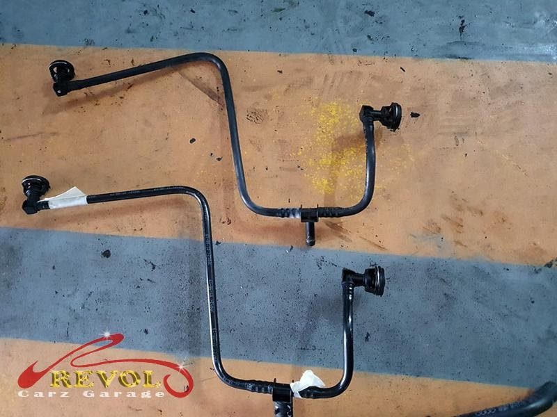 The new genuine Audi-spec coolant hose and clamps ready to fit.