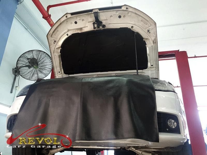 The engine oil drained on the Audi during the service.