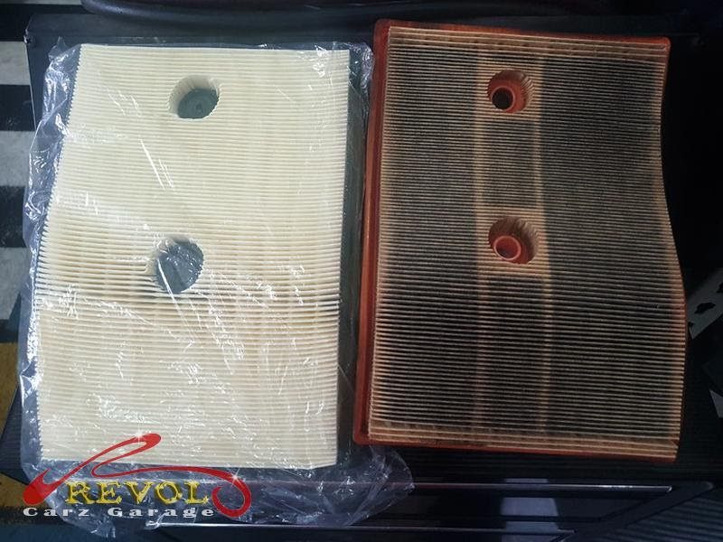 The dirty engine air filter removed.