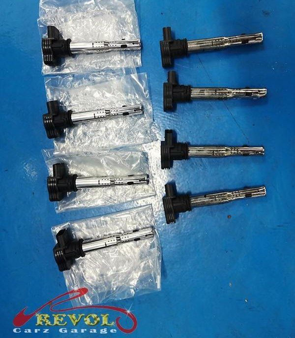 The old ignition coils and worn spark plugs removed.