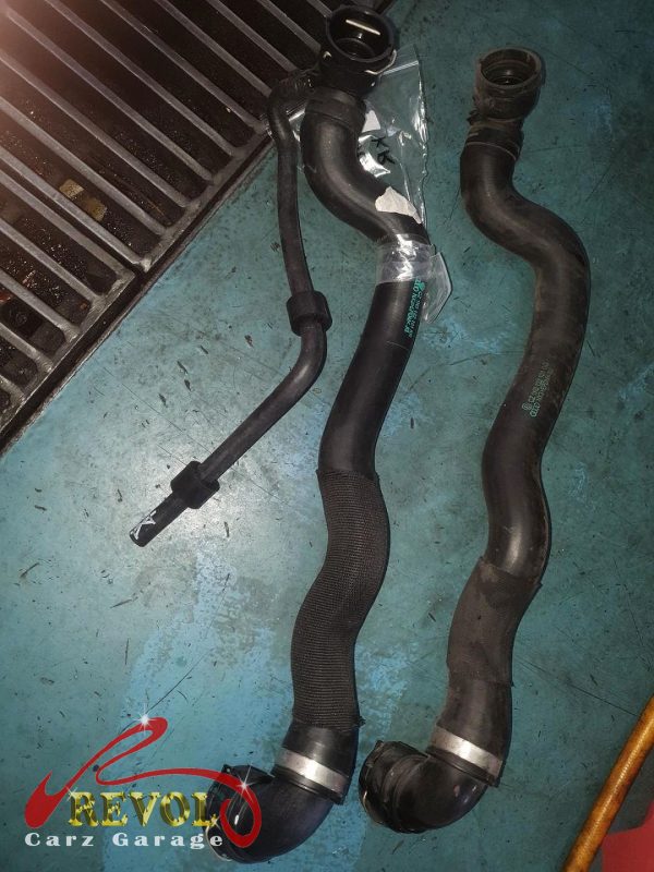 The new hoses installed and the cooling system refilled.