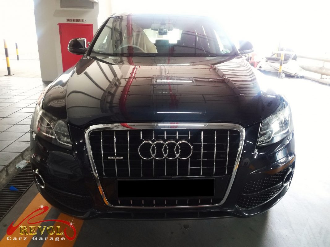 Audi Q5 parked at the workshop for a service and a check engine light.