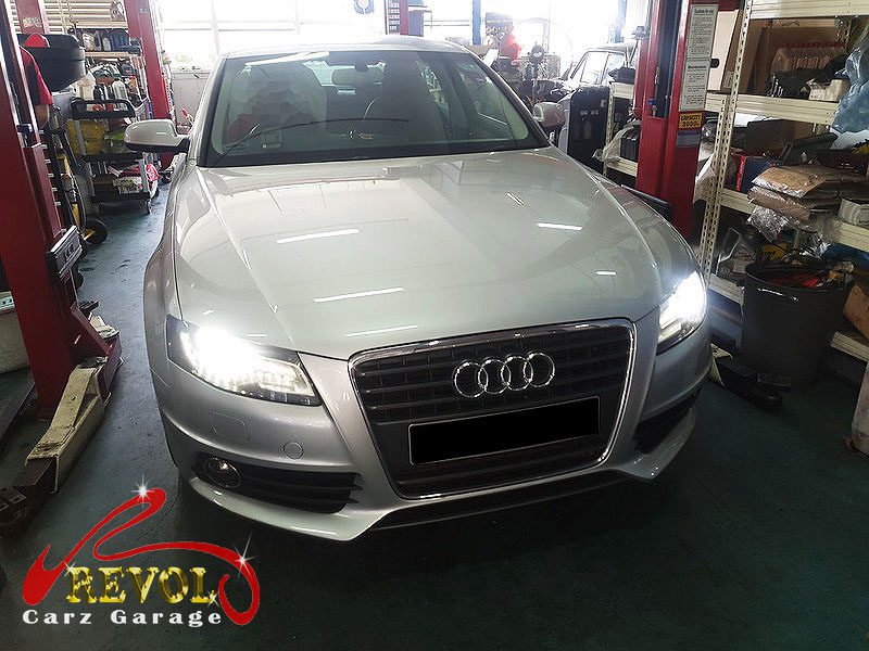 Audi A4 parked at the workshop for servicing.