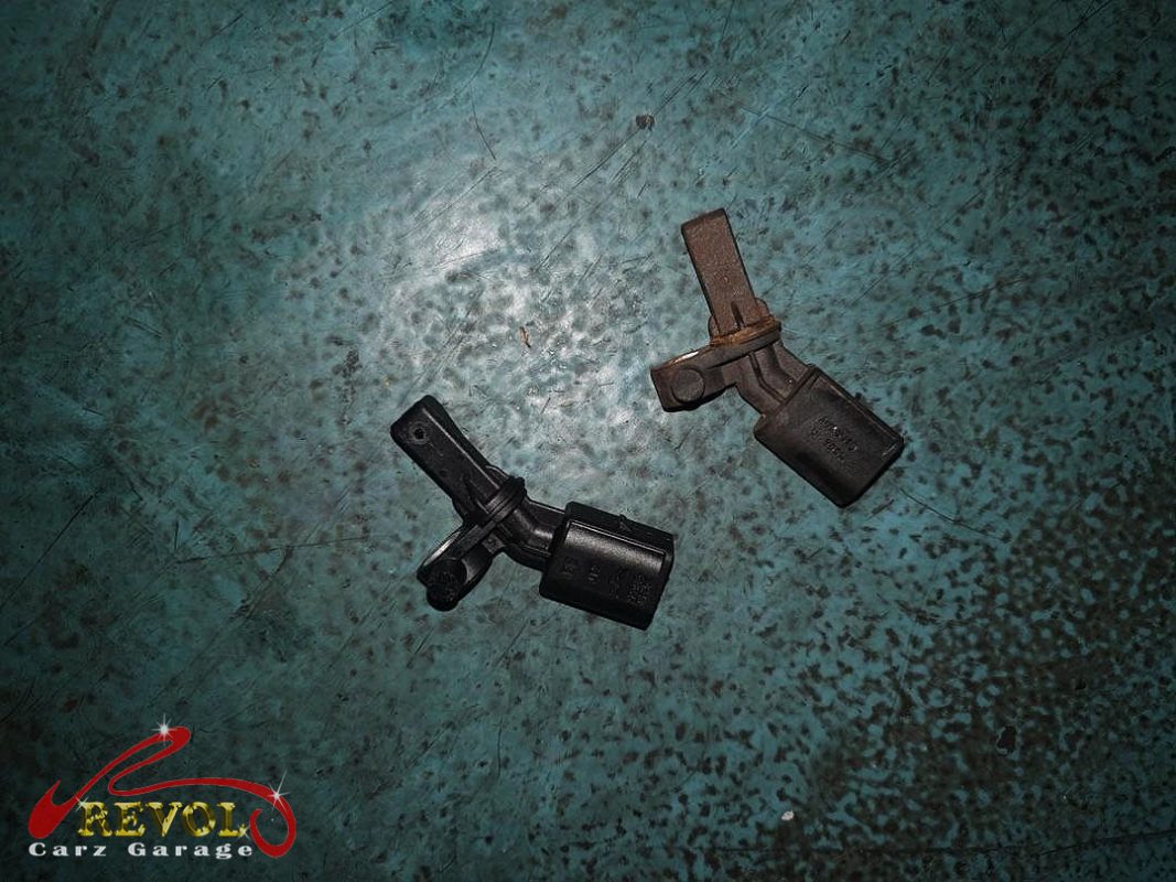 The old ABS sensor removed from the hub.
