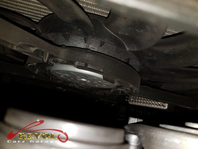 The jammed radiator cooling fan found restricting the pulley's movement.