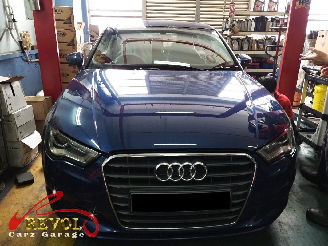 Audi A4 parked at the workshop for regular servicing.