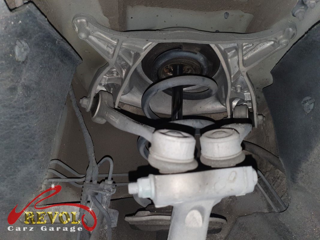 The Audi A4 on the lift, the knock traced to the front anti-roll bar drop links.