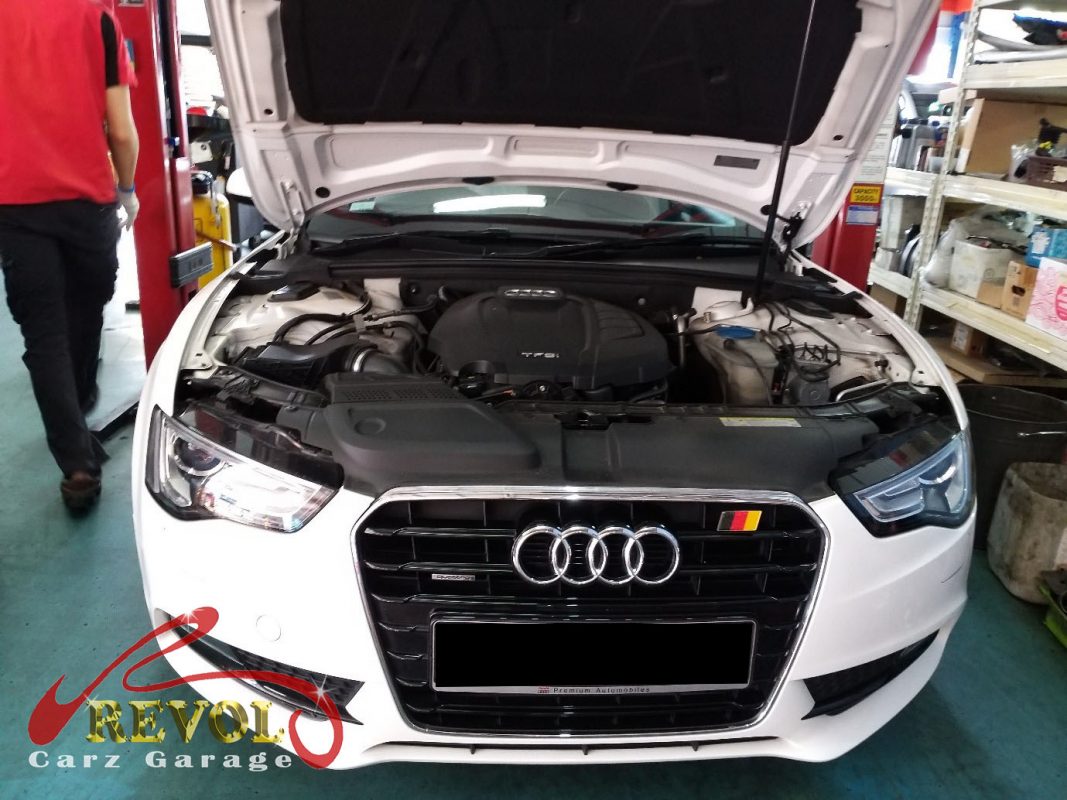 Audi A5 parked at the workshop for maintenance servicing.