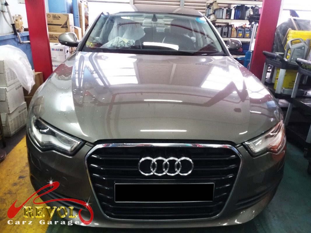 Audi A6 parked at the workshop, in for a valve cover oil leak diagnosis.
