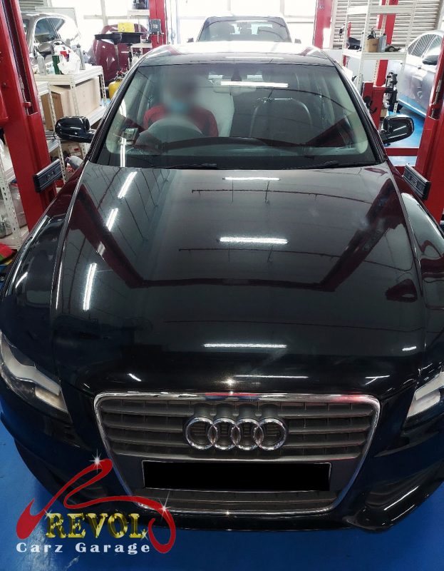 Audi A4 parked at the workshop for servicing.