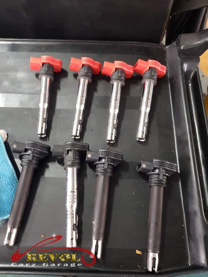 A full set of new genuine Audi-spec ignition coils ready for the replacement.