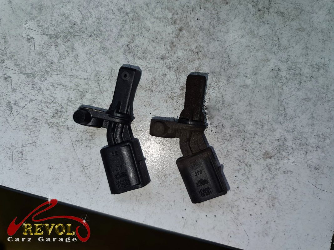 The old ABS sensor removed from the hub.