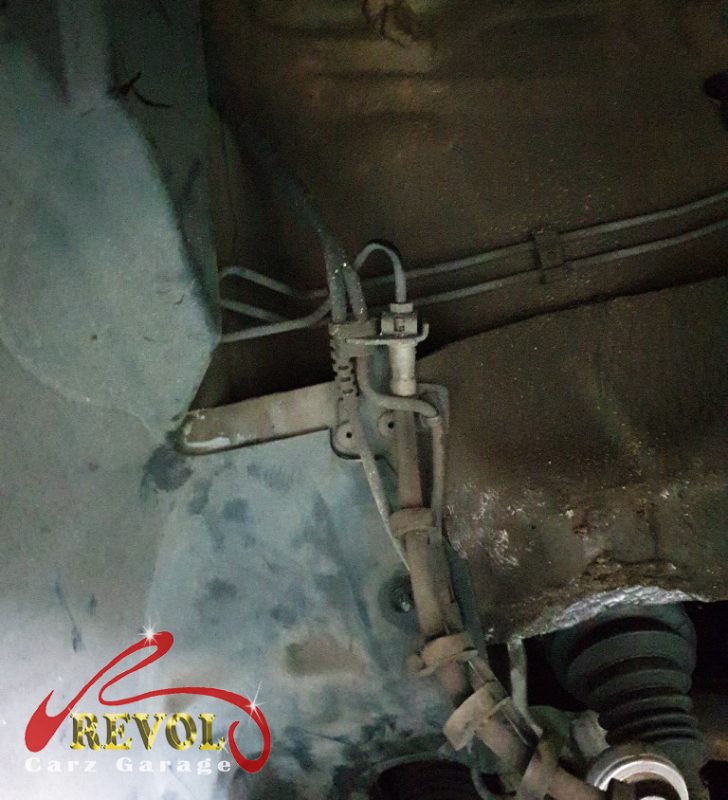 The front shock absorber that had lost its pressure on the Audi A4, weeping and weak.