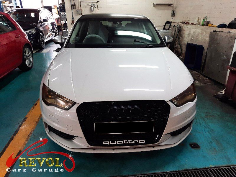 Audi A3 parked at the workshop, in for front brake inspection.