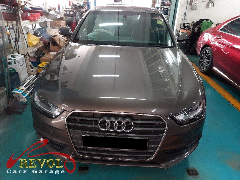 Audi A4 parked at the workshop for an Audi Care service and front suspension work.