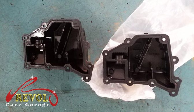 The old oil separator removed from the engine.