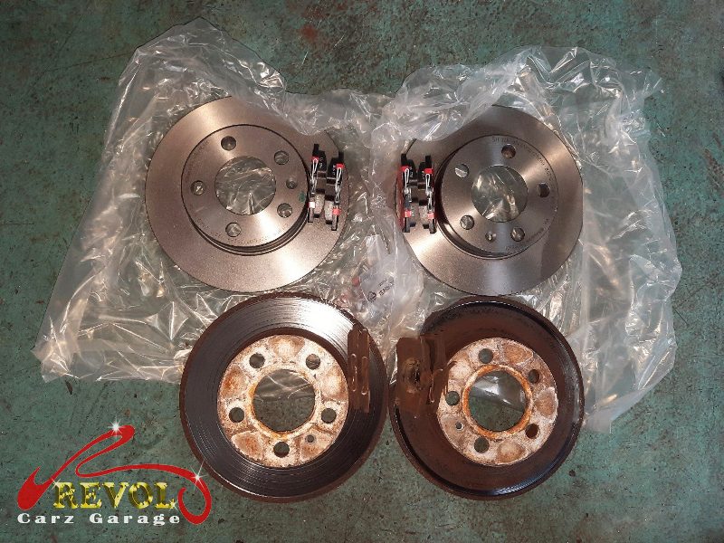 The new front brakes installed and the calipers serviced.