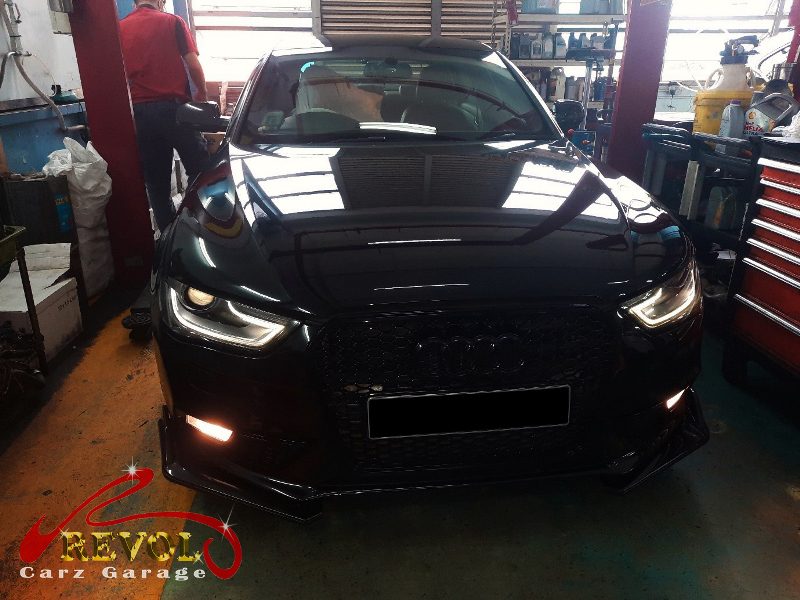Audi A4 parked at the workshop, in for front brake and shock absorber work.