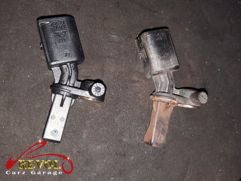 The old ABS sensor removed from the hub.