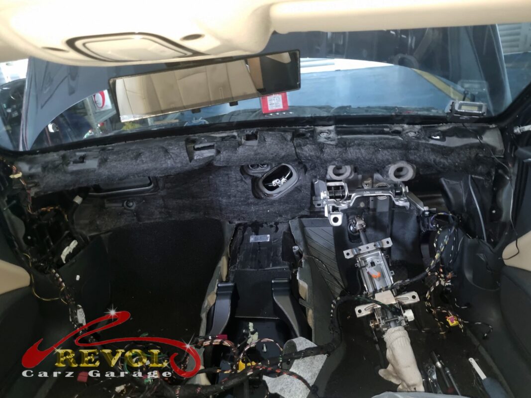 The A4's entire dashboard out, the bare bulkhead and HVAC box exposed. That is what it takes to reach the evaporator core.