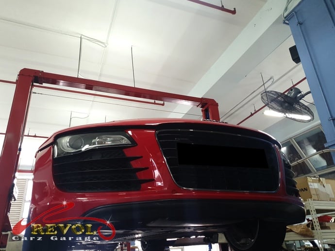 The Audi R8 raised for an undercarriage inspection and an aircon pipe leak check.