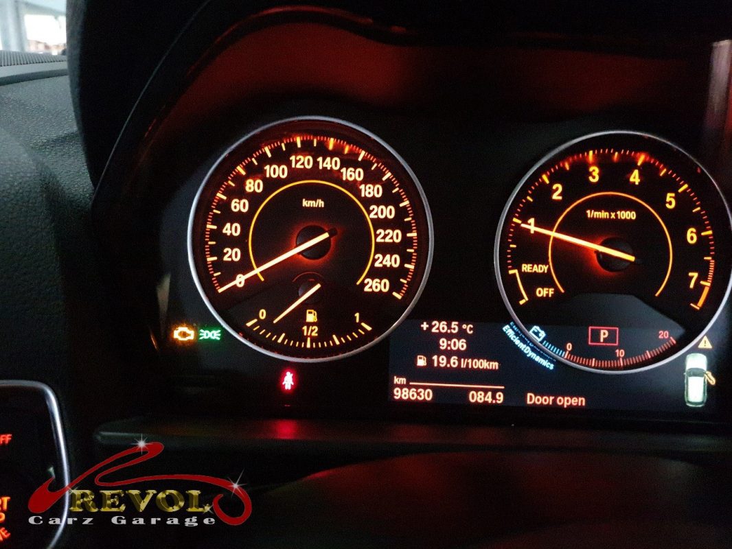 The BMW scan tool connected to the 135i showing the boost deviation.