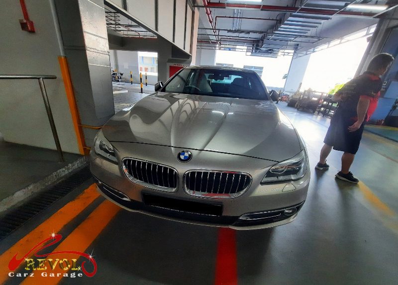 BMW 520i parked at the workshop, in for front shock absorber inspection.