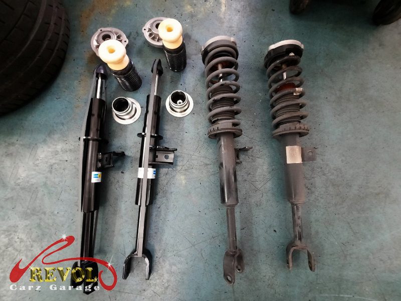 The new genuine BMW-spec front struts and top mounts ready to fit.