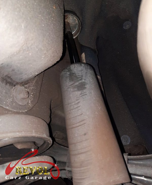 The old rear shocks removed alongside the new pair.