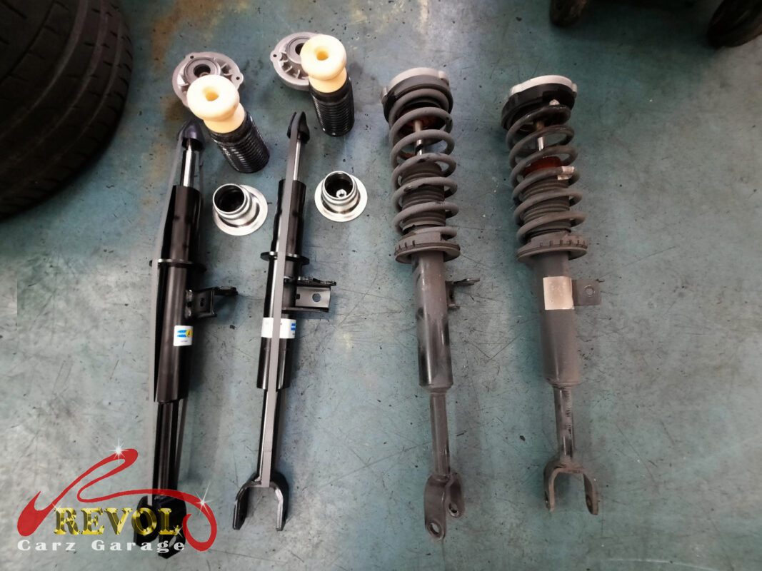 The new genuine BMW-spec front struts and top mounts ready to fit.
