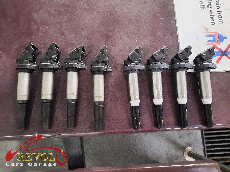 The old ignition coils and worn spark plugs removed.