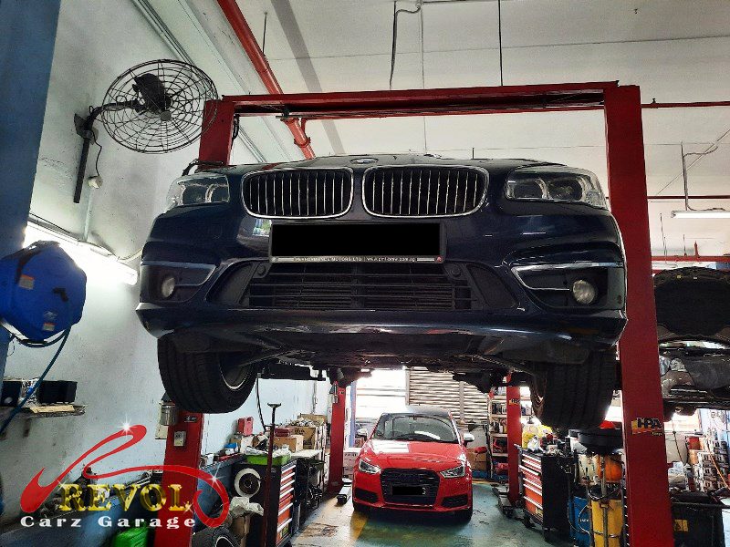 The worn shock absorbers on the BMW 216d, weeping and weak.