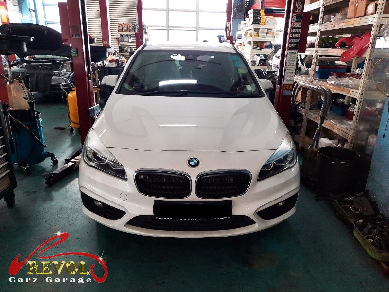 BMW 216d parked at the workshop, in for a safety inspection and battery replacement.