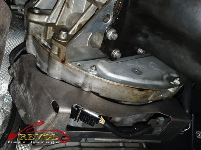 BMW 318i at the workshop, in for oil stains on the floor after parking.