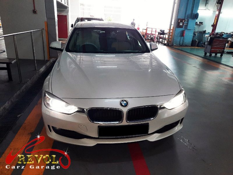 BMW 320i parked at the workshop for an ignition coil and spark plug service.