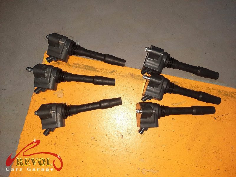 The old ignition coils and worn spark plugs removed.