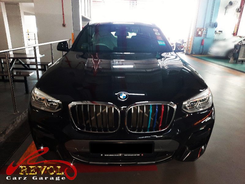 BMW X4 parked at the workshop, in for tie rod inspection.